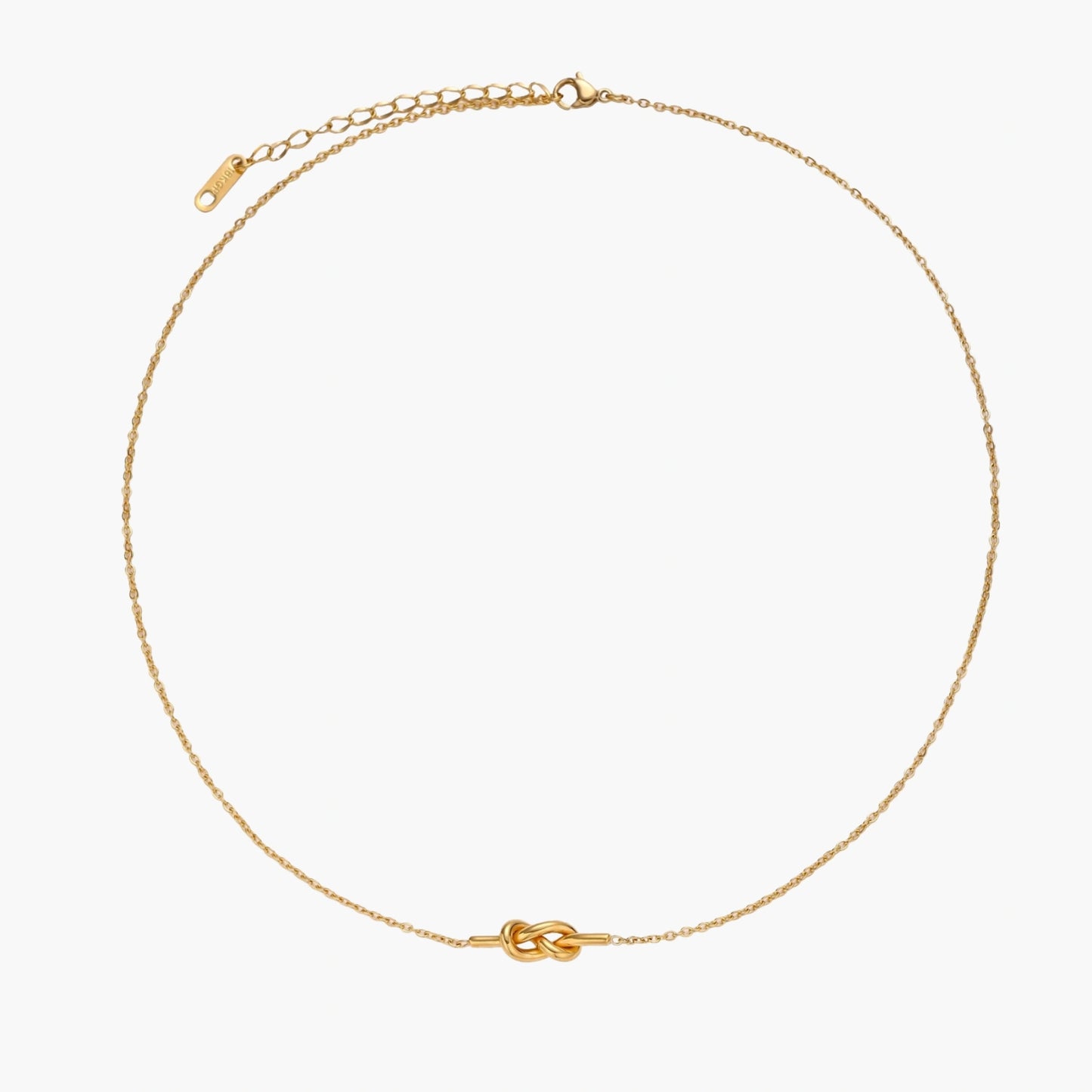 Dainty 18K gold plated necklace with infinity knot pendant on delicate chain against white background